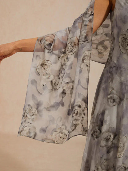 Robe longue à col bénitier et ourlet à volants